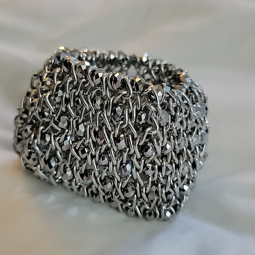 Silver colored beaded shiny cuff stretch bracelet